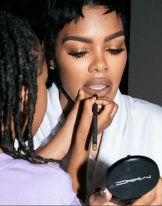 Teyana Taylor getting her makeup done.