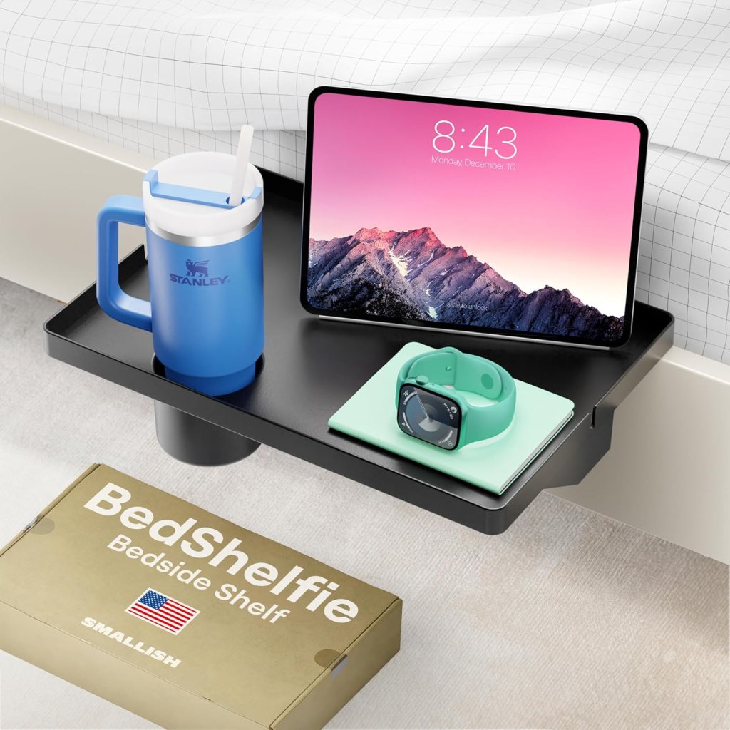 black bedside shelf with small objects on top