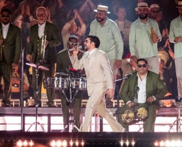 Bad Bunny Slips & Falls During Concert, But His Fans Keep the Show Going for Him