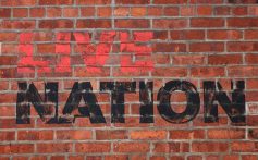 NEW YORK, NEW YORK - MAY 23: The Live Nation logo is seen at its NYC headquarters on May 23, 2024 in New York City. The Department of Justice has filed a federal lawsuit that accuses Ticketmaster and its parent company Live Nation of illegally monopolizing the live entertainment industry to the detriment of concertgoers and artists alike. The lawsuit seeks to structure how the company operates and includes breaking apart the two entities.  (Photo by Michael M. Santiago/Getty Images)