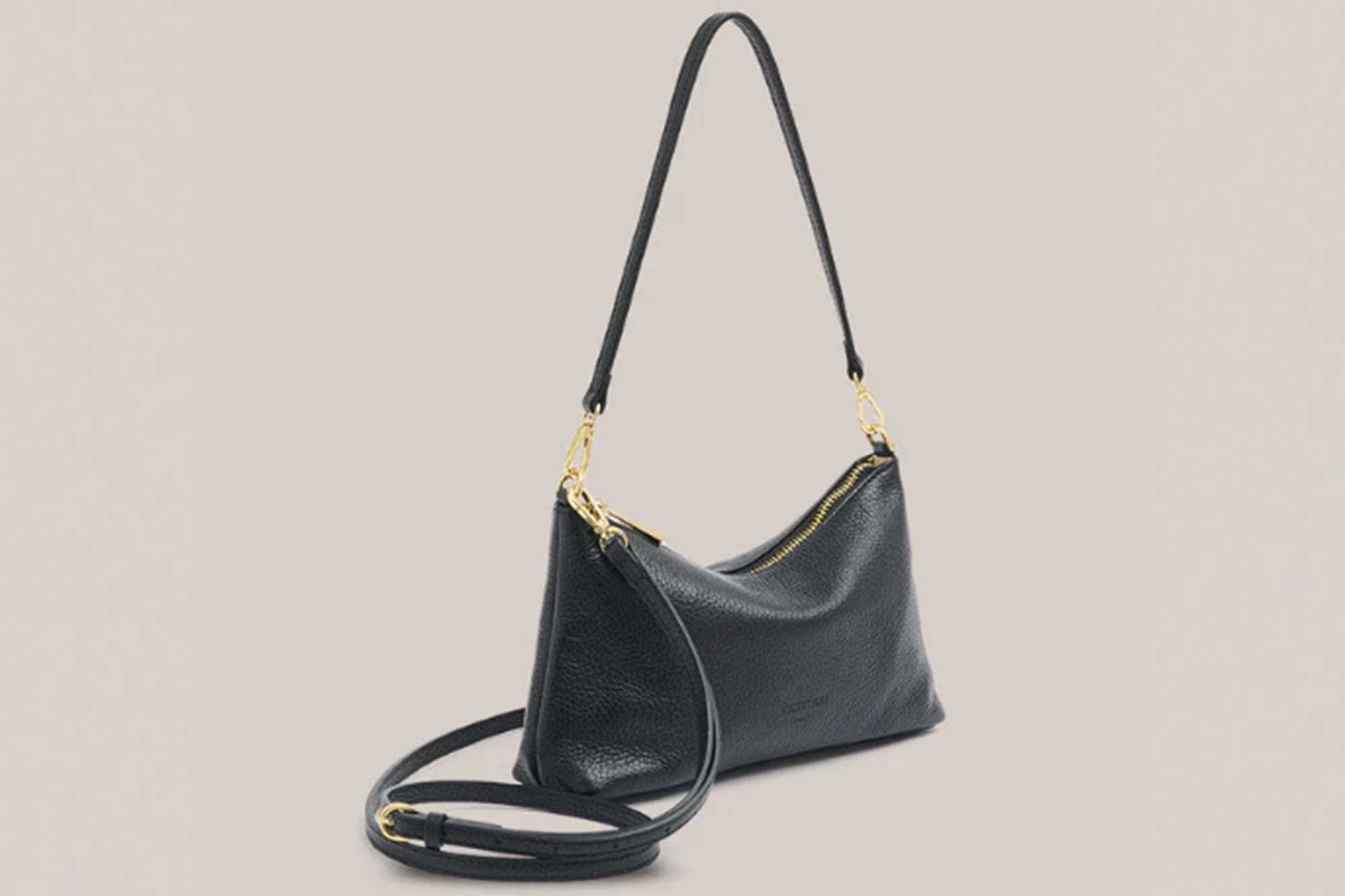 Black leather shoulder bag with a long strap and gold zipper.