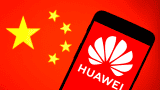 In this photo illustration a Huawei logo is displayed on a smartphone with a Chinese flag in the background.