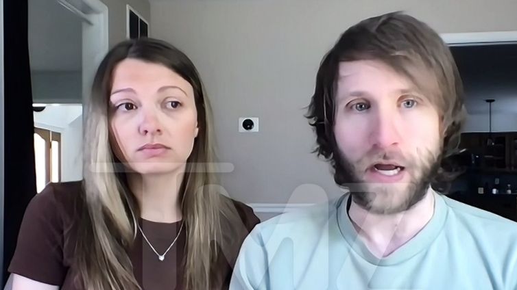 Influencer Couple Sleeps With Gun by Bedside Amid Down Syndrome Death Threats