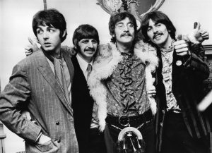 The Beatles celebrate the completion of their album 'Sgt. Pepper's Lonely Hearts Club Band' at a press conference on May 19, 1967, at the west London home of their then-manager, Brian Epstein.