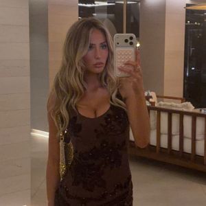 Alix Earle Flashes Cleavage in Tight Black Dress in Ibiza
