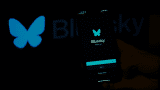 The BlueSky logo is displayed on a mobile phone screen with its icon in back of it.