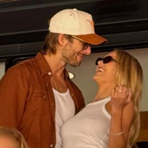 Glen Powell & Michelle Randolph All Smiles During Rare Outing At Texas-Tennessee Game