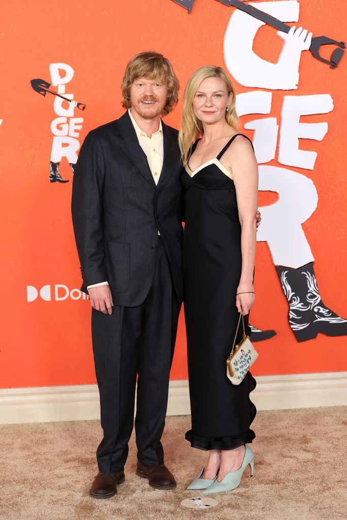 Jesse Plemons and Kirsten Dunst posing together at the premiere of "Digger."