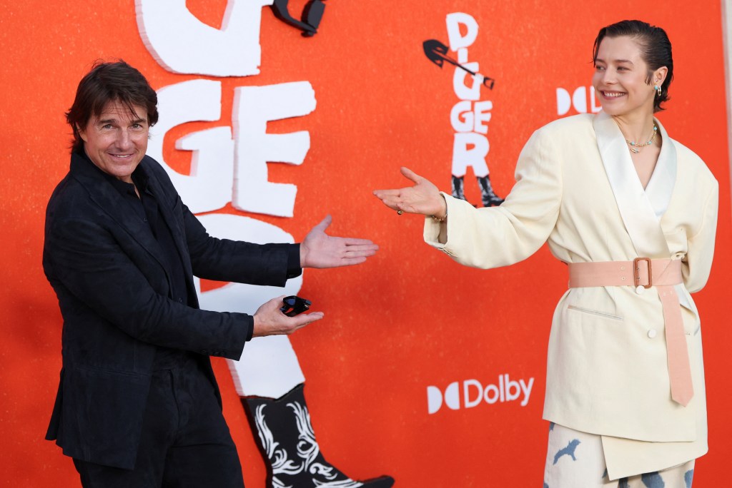 Tom Cruise and Emma D'Arcy pose for a photo at the premiere of the film "Digger".