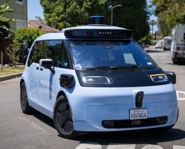 Waymo and Zoox expand into more U.S. markets as robotaxi race heats up